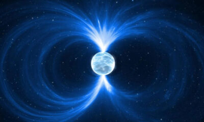 Small icy planet in space with bright blue magnetic field lines looping around it.