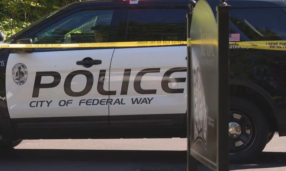 Police SUV with 'POLICE' and 'City of Federal Way' markings, yellow caution tape across the scene.