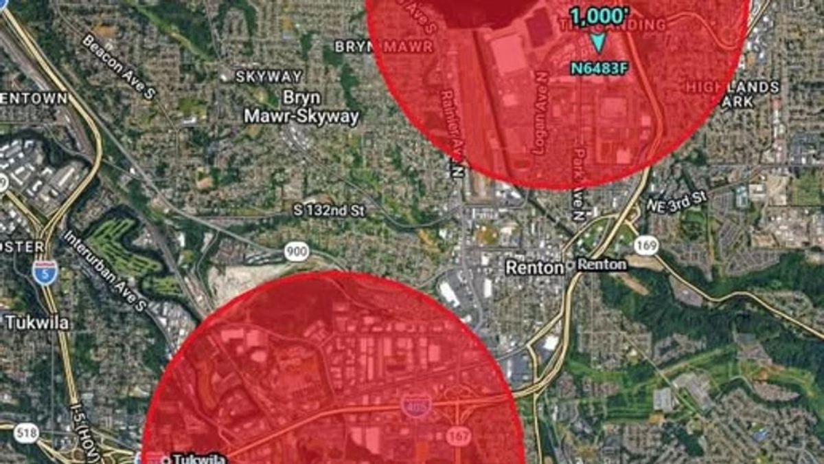 Map showing red circular hazard zones over Renton and Tukwila areas with major highways I-405 and I-5 nearby.