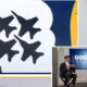 Collage: left panel shows a mural with four black birds in a white cloud on blue and yellow background; bottom-right shows a 'Good Day Seattle' interview setup with two people.