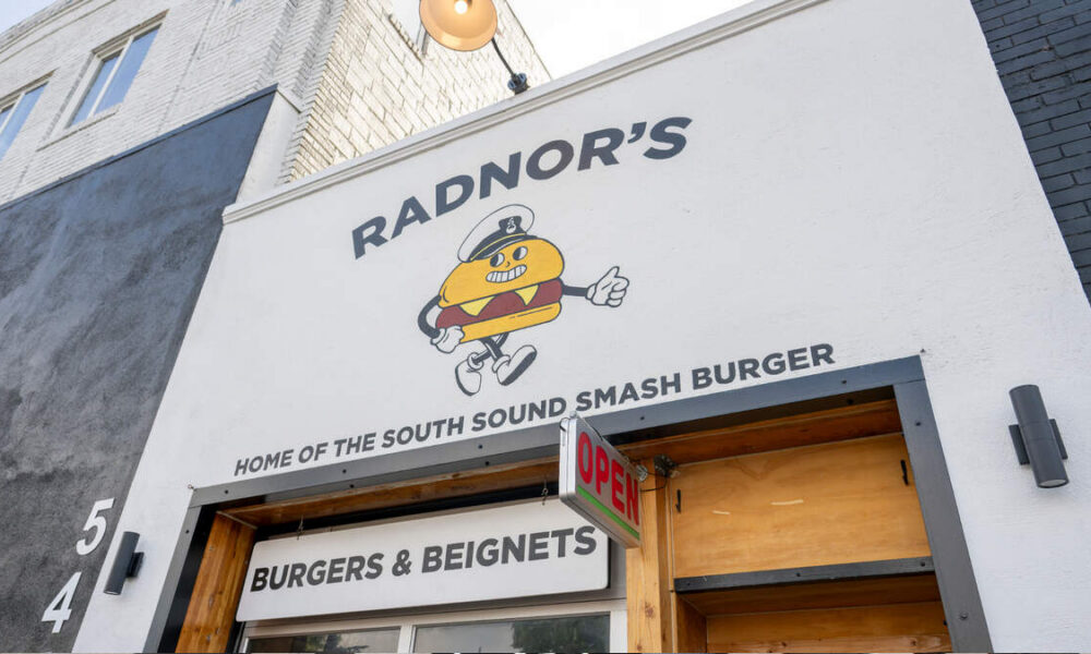Exterior of Radnor's restaurant with a cartoon burger mascot and bold sign reading 'RADNOR'S'.