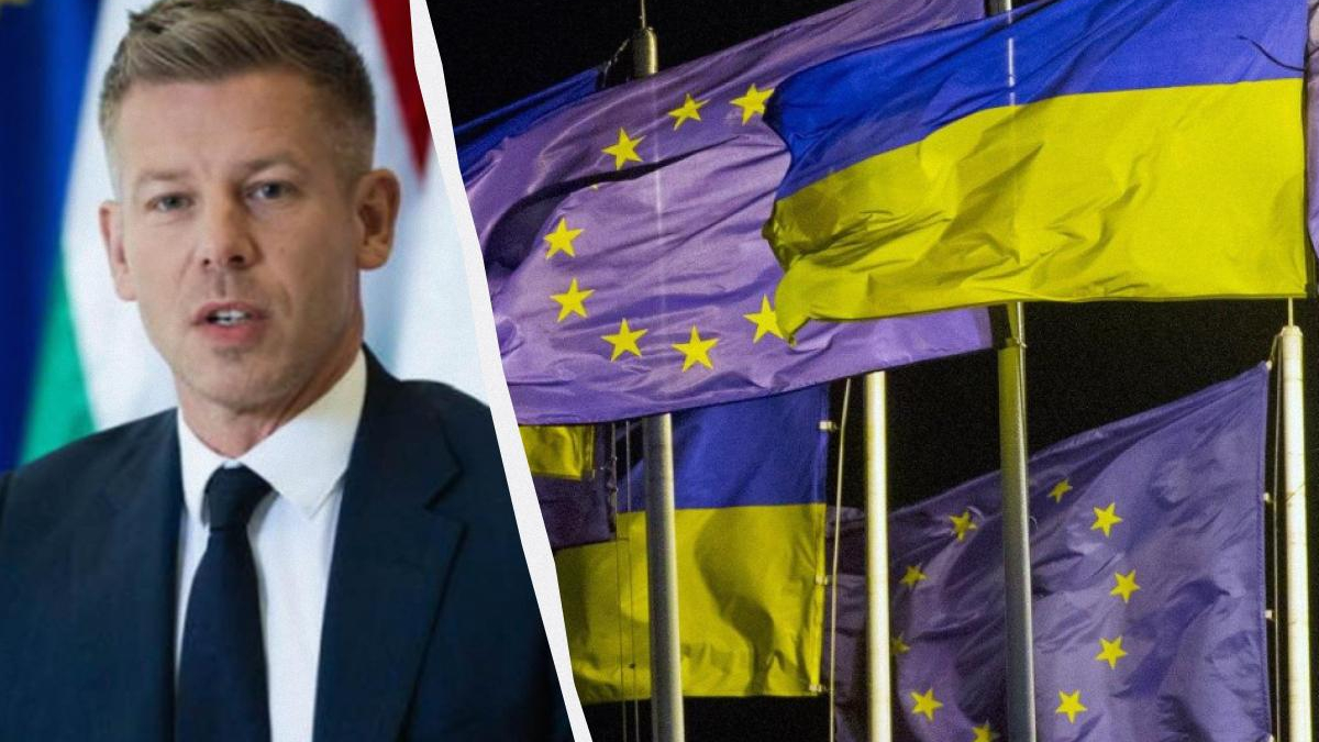 Speaker in a dark suit and tie addressing an audience, with Ukrainian and European Union flags in the background split diagonally by a white seam.