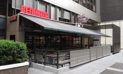 Exterior of a Benihana restaurant with outdoor seating under a large white awning/terrace.