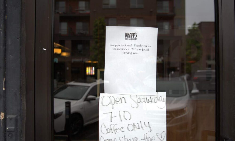 Window with a Knapp's Restaurant closure notice above a handwritten sign reading 'Open Saturday 7-10 Coffee only'.