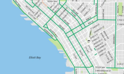 Section of a Seattle street map showing bold green transit routes along the waterfront near Elliott Bay