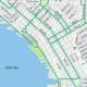 Section of a Seattle street map showing bold green transit routes along the waterfront near Elliott Bay
