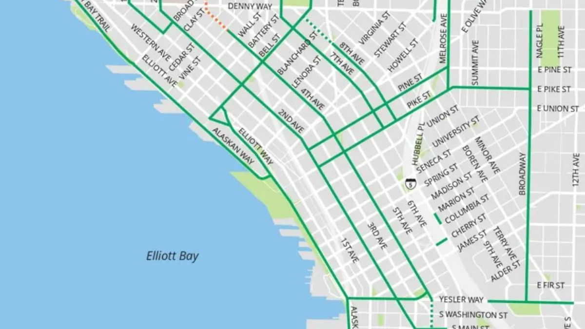 Section of a Seattle street map showing bold green transit routes along the waterfront near Elliott Bay