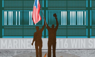 Two people in brown silhouettes raise an American flag on a podium in front of a teal stadium backdrop and banner text.