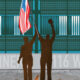 Two people in brown silhouettes raise an American flag on a podium in front of a teal stadium backdrop and banner text.