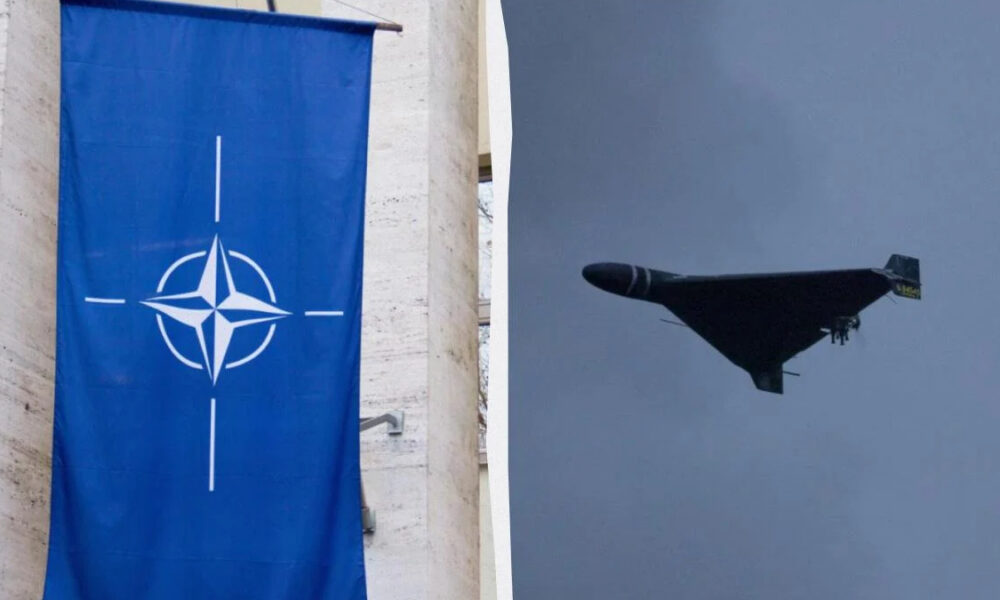 Blue banner displaying the NATO emblem (compass rose) hanging on a stone wall left side; right side shows a flying B-2 Spirit stealth bomber against a cloudy sky