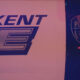 Sign with 'KENT' and large stylized letters beside a Kent Police shield logo on a dark background.