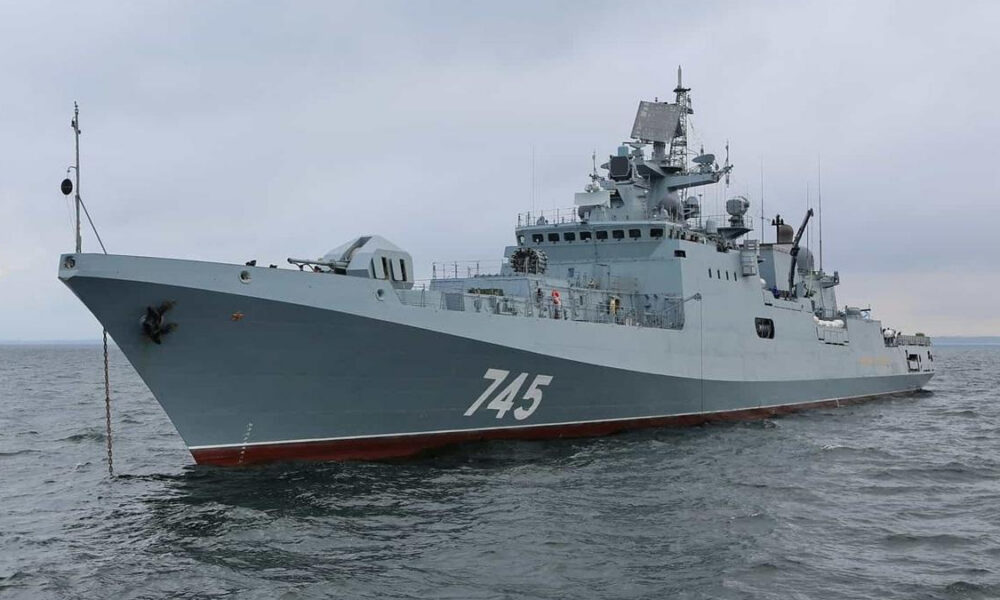 Gray naval destroyer at sea, hull number 745 visible on the bow