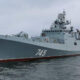 Gray naval destroyer at sea, hull number 745 visible on the bow