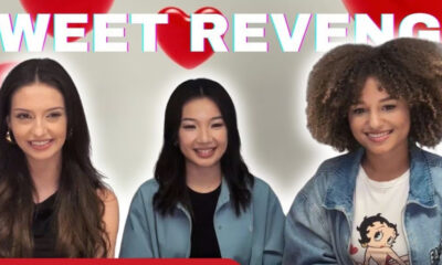 Three smiling women sit side by side in a bright background with pink text and red hearts in a banner-style image.