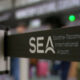 Barrier queue barrier with the SEA logo for Seattle-Tacoma International Airport