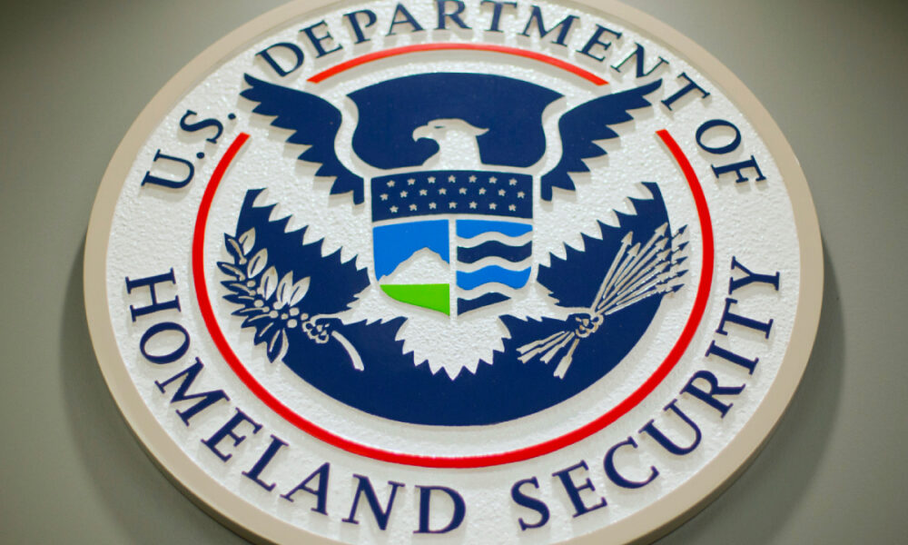 Seal of the U.S. Department of Homeland Security featuring an eagle with shield and blue, red, and white colors on a circular emblem.