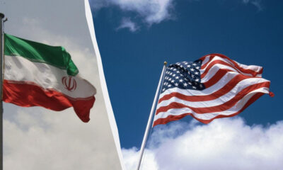Split image showing the Iranian flag on the left and the American flag on the right, waving in the wind.