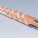 Orange streamlined high-speed train gliding along parallel railroad tracks against a pale sky, viewed from the side with white stripes on its body.