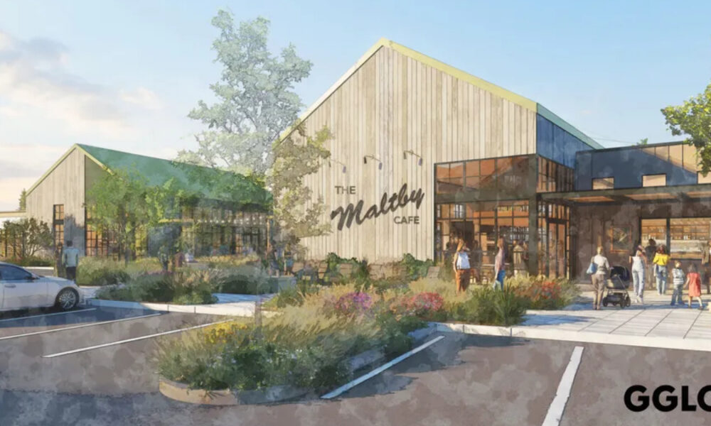 Rendering of a modern cafe with wood siding, large glass walls, and landscaped planters; people walk toward the entrance.
