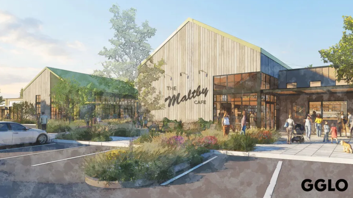 Rendering of a modern cafe with wood siding, large glass walls, and landscaped planters; people walk toward the entrance.