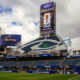Seattle FIFA World Cup 2026 stadium with large screens displaying 'Seattle' and a green field in the foreground