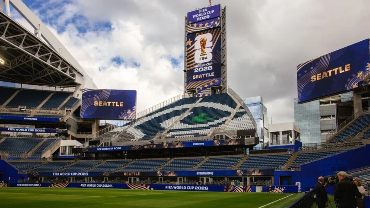 Seattle FIFA World Cup 2026 stadium with large screens displaying 'Seattle' and a green field in the foreground