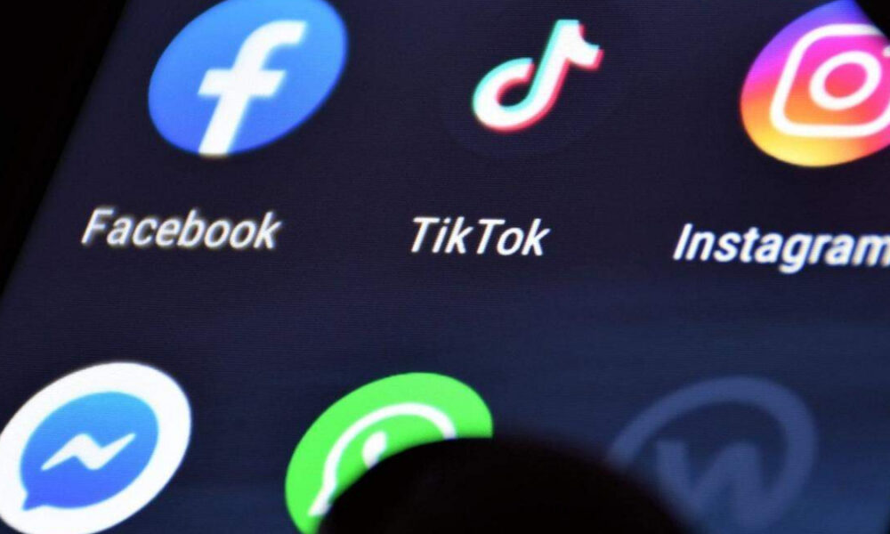 Grid of social media app icons with labels: Facebook, TikTok, Instagram, Messenger, and WhatsApp (partial).