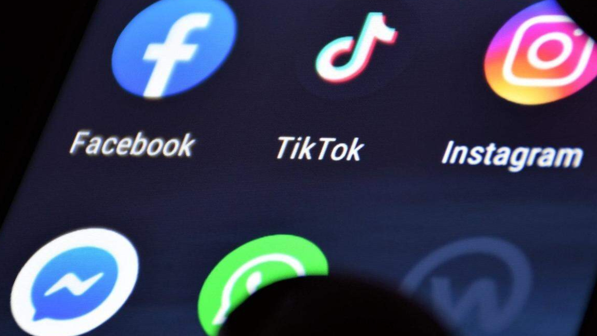 Grid of social media app icons with labels: Facebook, TikTok, Instagram, Messenger, and WhatsApp (partial).