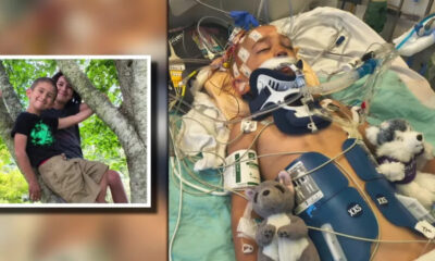 Child in intensive care with a breathing tube and neck brace, connected to monitors; a separate framed photo shows two siblings in a tree.