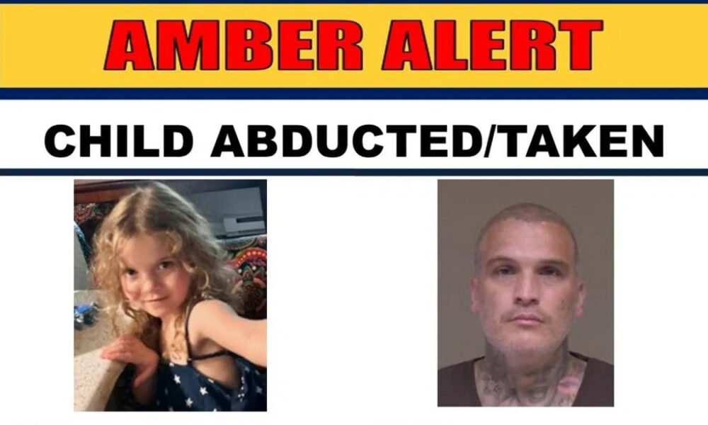 Amber Alert banner reading 'CHILD ABDUCTED/TAKEN' with photos of a young girl and a tattooed man.