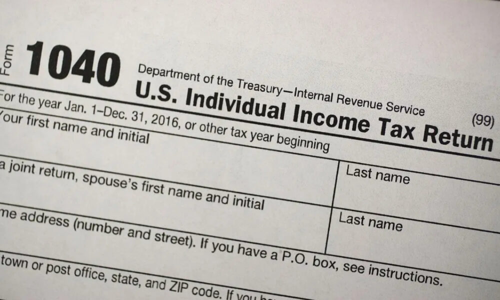 Top of an IRS Form 1040: Department of the Treasury, U.S. Individual Income Tax Return title and year fields visible.