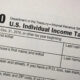 Top of an IRS Form 1040: Department of the Treasury, U.S. Individual Income Tax Return title and year fields visible.
