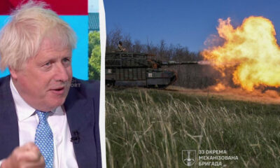 Split-screen image: left side shows a man in a dark suit and light blue tie speaking on a TV program; right side shows a tank firing a large flame in a grassy field, with a Ukrainian brigade insignia visible in the bottom corner.