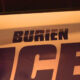 Close-up of a police car door with large 'POLICE' lettering; the word above appears to read 'BURIEN'.