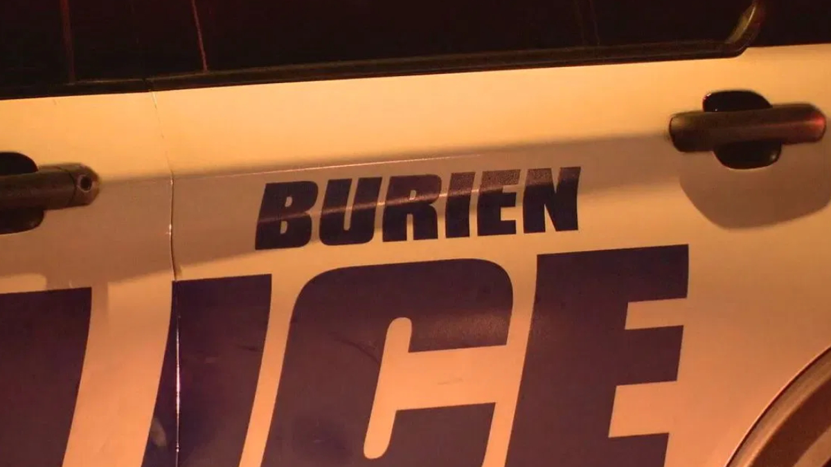 Close-up of a police car door with large 'POLICE' lettering; the word above appears to read 'BURIEN'.
