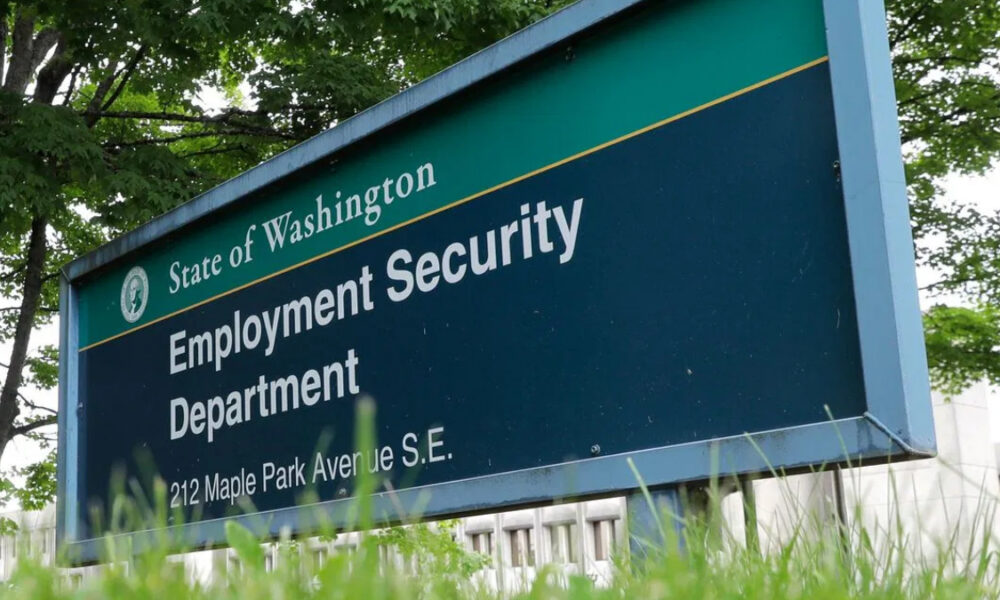Sign for the State of Washington Employment Security Department, 212 Maple Park Avenue SE, outdoors in a grassy area with trees in the background.