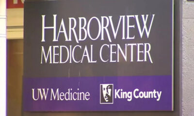 Harborview Medical Center sign with UW Medicine and King County logos on a purple band