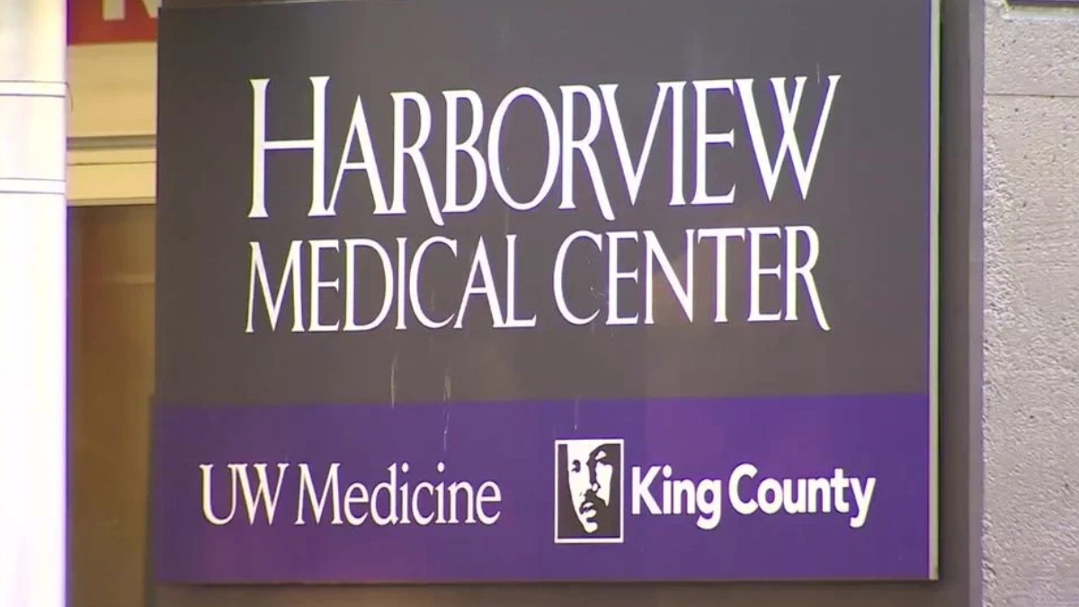 Harborview Medical Center sign with UW Medicine and King County logos on a purple band