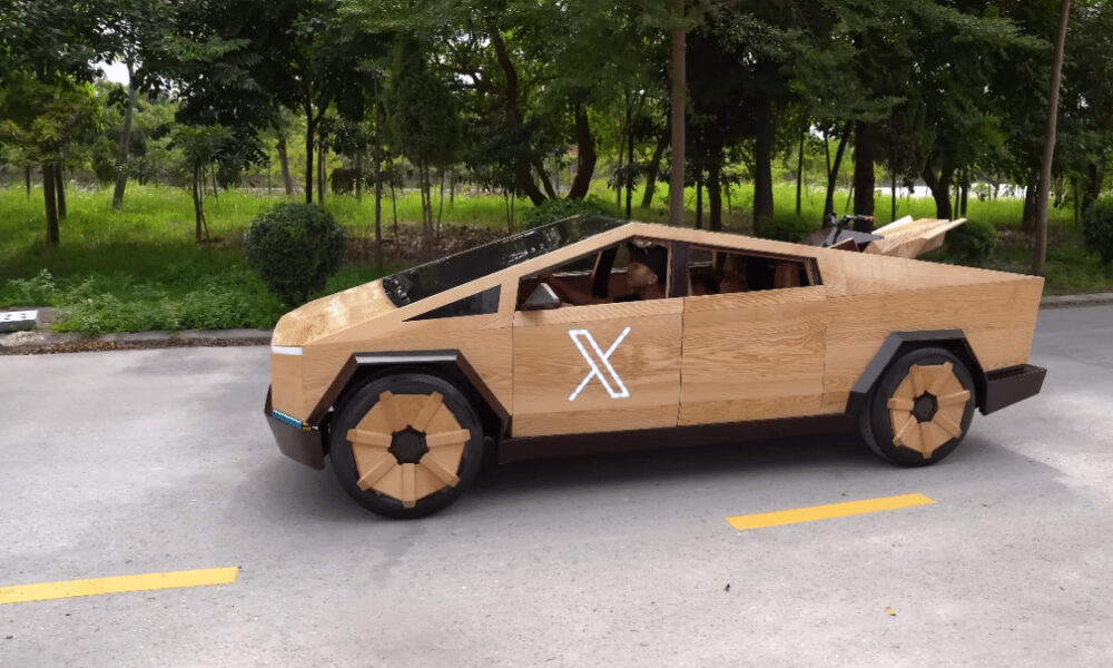 Wooden-paneled futuristic car sculpture parked on a street, with a white X on the door and wooden wheels.