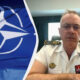 Split image: NATO flag on the left and a senior naval officer in white dress uniform on the right.