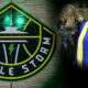 Seattle Storm emblem fills the left side as two women walk together on the right, one in a blue gown with a yellow scarf, smiling.
