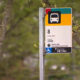 Bus stop sign for Route 8 (Seattle Center) on a metal pole, King County Metro, with wheelchair accessibility symbol nearby