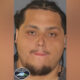 Mugshot of a man with short dark hair and a goatee, wearing a gray shirt; Pierce County Sheriff badge visible in the corner.