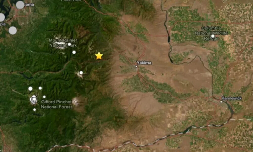 Satellite map showing Yakima area with Mount Rainier National Park to the west and a yellow star marker indicating a location near the Cascade foothills.