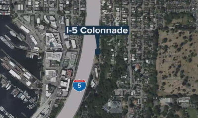 Aerial map showing I-5 Colonnade label along a highway beside a marina and buildings in a coastal city.