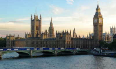 Sunlit view of the Palace of Westminster with Big Ben along the River Thames, seen from Westminster Bridge.