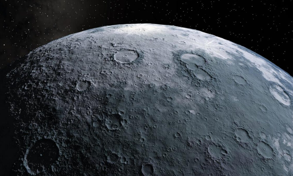 Close-up view of a cratered lunar surface against a starry black space background,