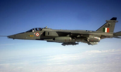 Italian Air Force Tornado jet in flight, two-seat cockpit, roundel on fuselage, Italian flag tail insignia.