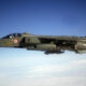 Italian Air Force Tornado jet in flight, two-seat cockpit, roundel on fuselage, Italian flag tail insignia.