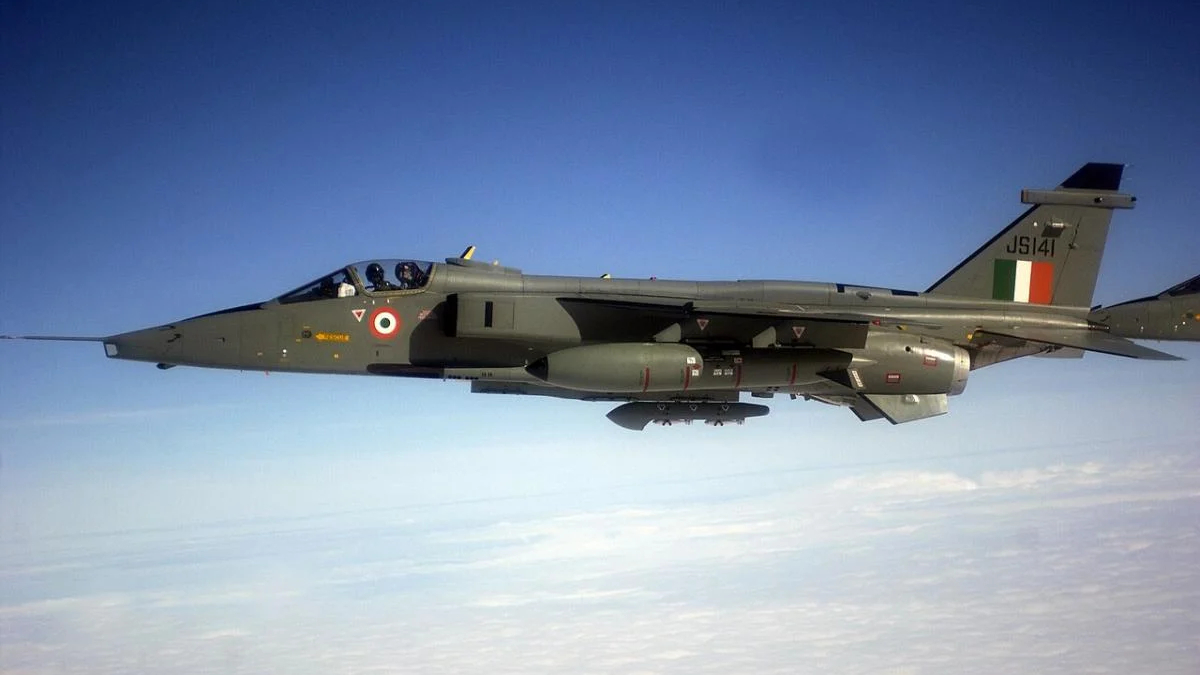Italian Air Force Tornado jet in flight, two-seat cockpit, roundel on fuselage, Italian flag tail insignia.